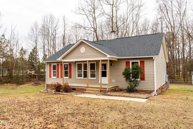 view of front of house with a porch, a shingled roof, fence, crawl space, and a chimney