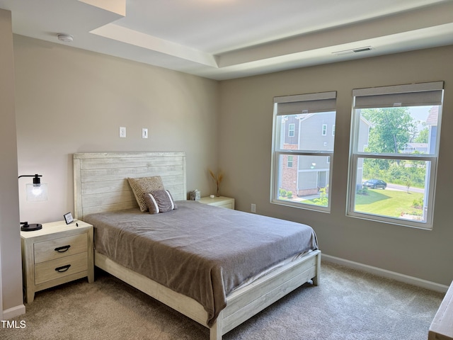 730 Firebrick Dr, Cary, NC 27519 - bedroom with light carpet, baseboards, and a tray ceiling