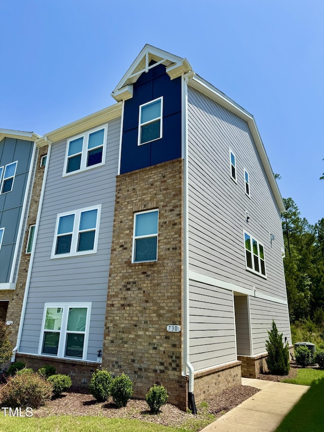 730 Firebrick Dr, Cary, NC 27519 - view of side of home featuring brick siding