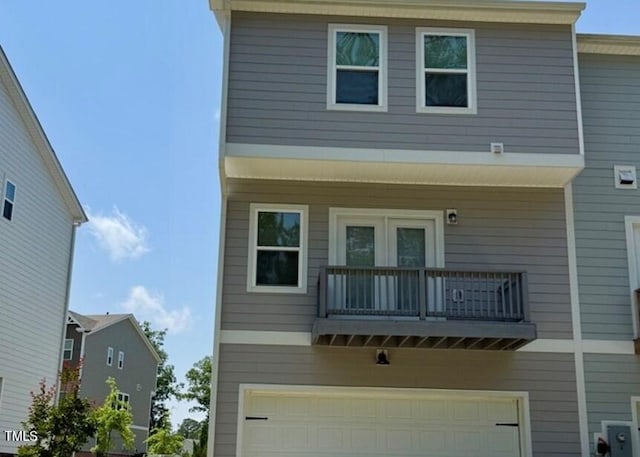 730 Firebrick Dr, Cary, NC 27519 - rear view of house with a balcony and an attached garage