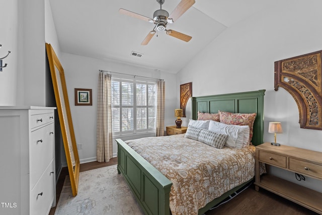 bedroom with lofted ceiling, visible vents, light wood-style flooring, a ceiling fan, and baseboards