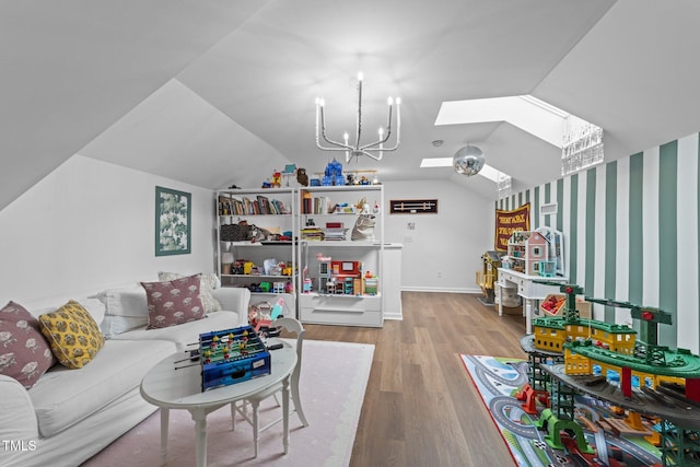 living area featuring lofted ceiling with skylight, baseboards, and wood finished floors