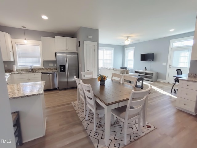 dining room with recessed lighting, baseboards, ceiling fan, and light wood finished floors