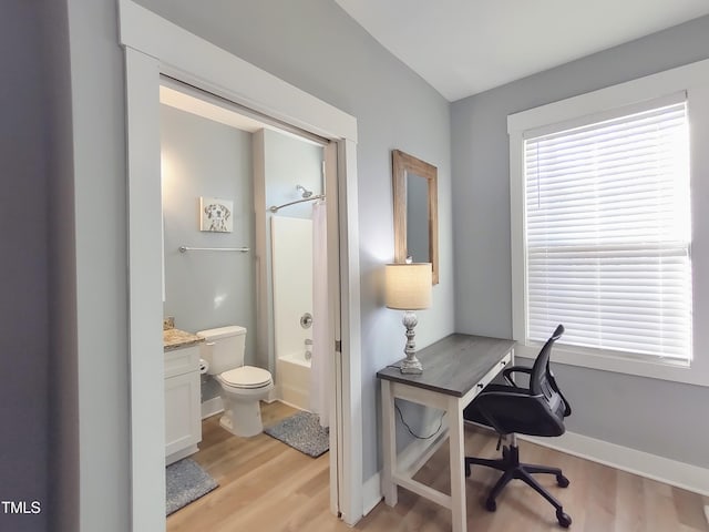 office area featuring light wood finished floors and baseboards