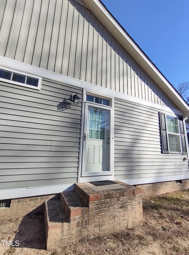 view of exterior entry featuring crawl space