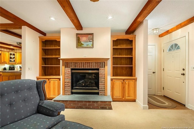 carpeted living room featuring recessed lighting, beam ceiling, a fireplace, and baseboards