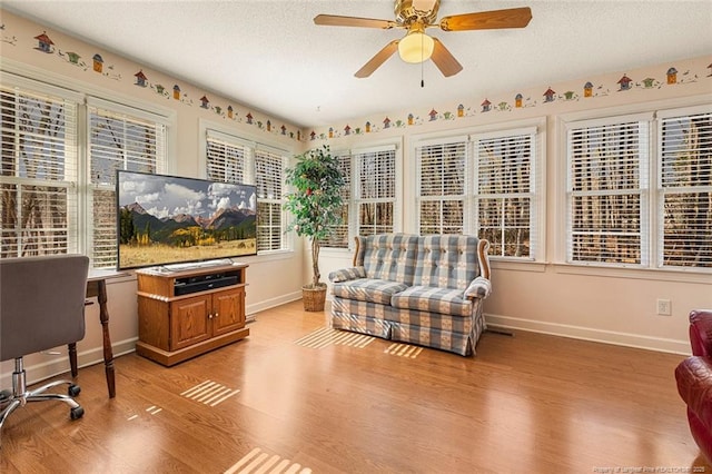 interior space featuring a ceiling fan