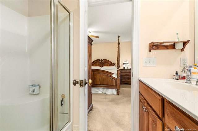 bathroom with a stall shower, ensuite bath, and vanity