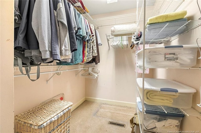 walk in closet featuring carpet and visible vents