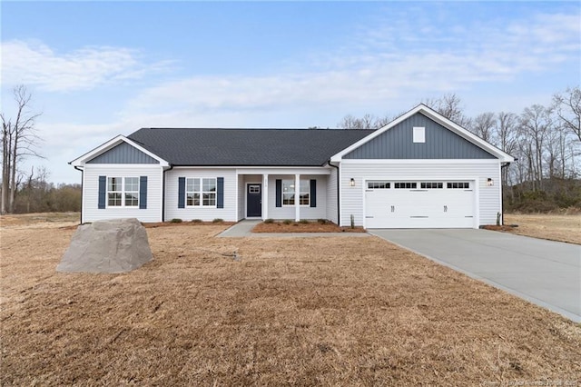 ranch-style house with concrete driveway, a shingled roof, an attached garage, and a front yard