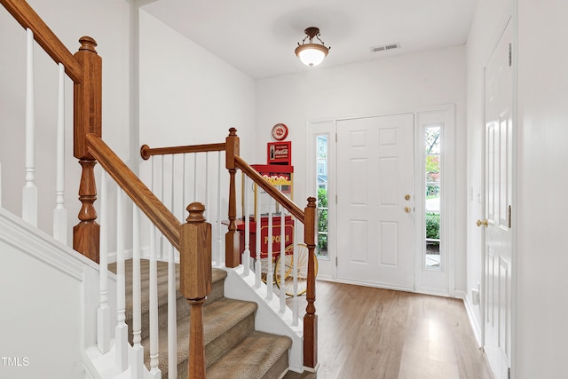 entrance foyer with visible vents and wood finished floors