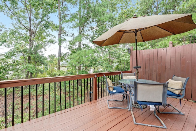 deck with outdoor dining area