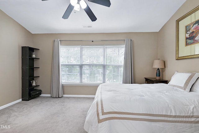 carpeted bedroom featuring visible vents, ceiling fan, and baseboards