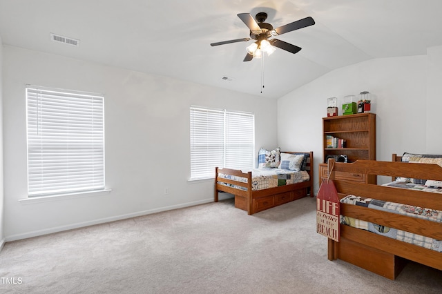 bedroom with light carpet, baseboards, visible vents, and vaulted ceiling