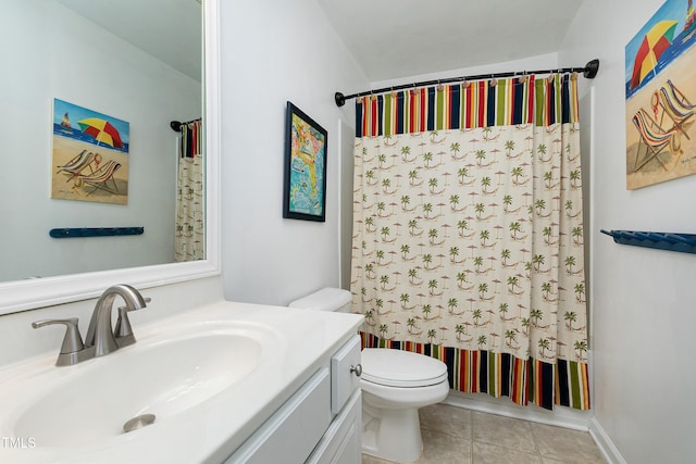 full bathroom featuring vanity, toilet, and tile patterned floors