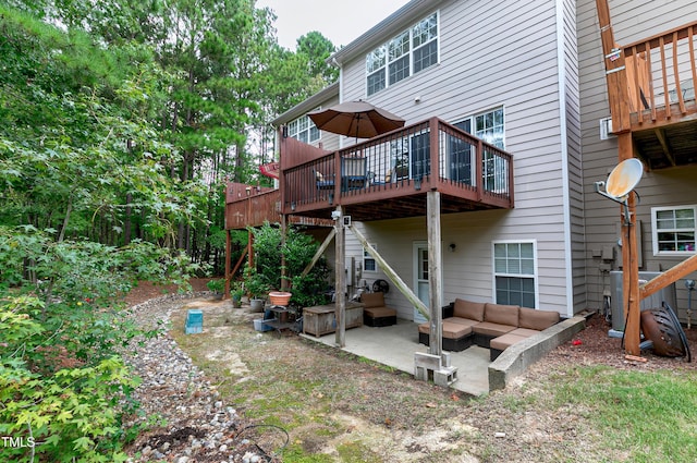 rear view of property featuring a patio area