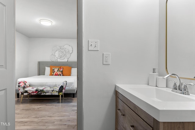 bathroom featuring vanity and wood finished floors