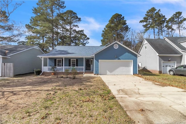 ranch-style home featuring covered porch, concrete driveway, and a garage