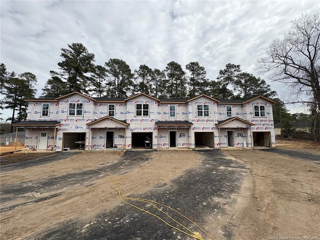 property under construction featuring driveway