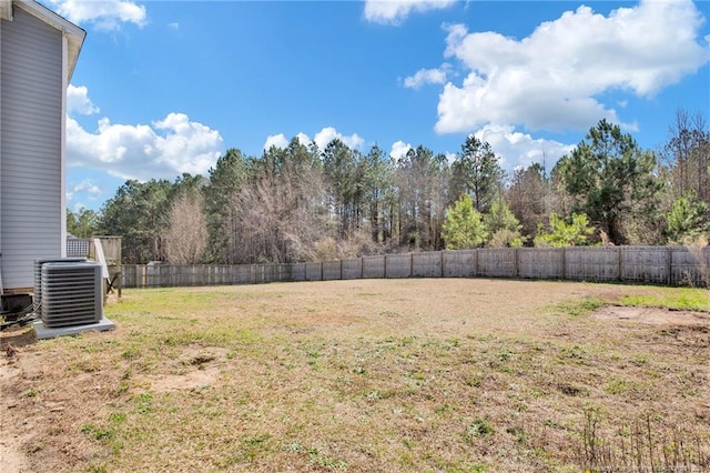 view of yard featuring a fenced backyard and central AC unit