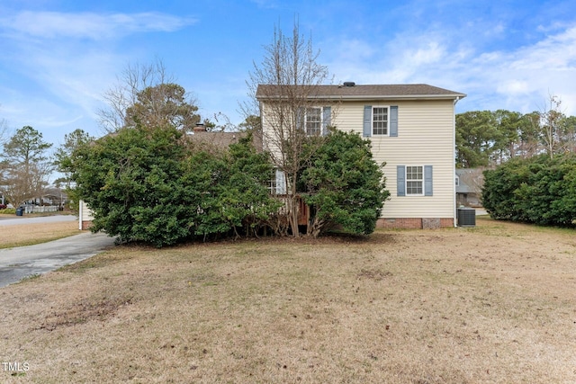 view of home's exterior with crawl space, a lawn, and central AC