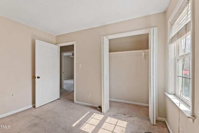 unfurnished bedroom featuring a closet, carpet, and baseboards