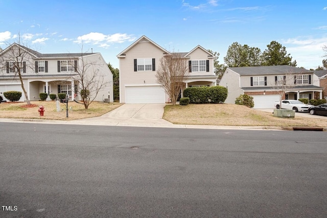 traditional-style home with driveway and a garage