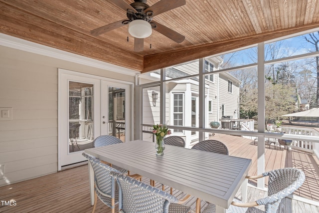 sunroom / solarium featuring wooden ceiling, a ceiling fan, and french doors