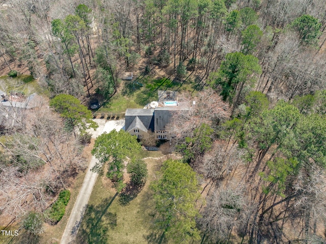 bird's eye view featuring a forest view