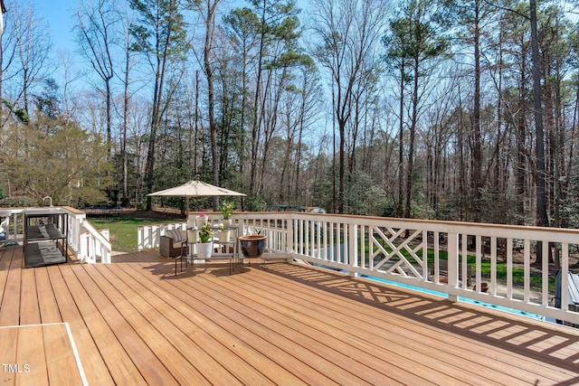 deck with a wooded view