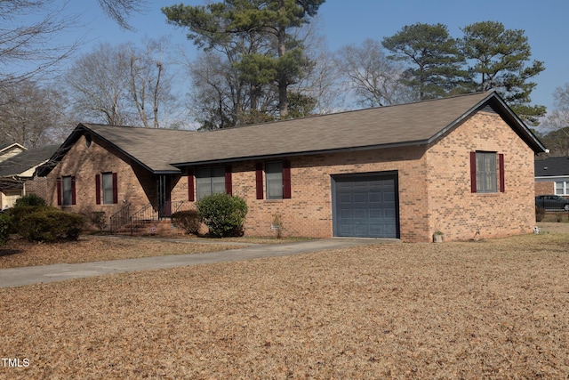 view of front facade with brick siding, concrete driveway, roof with shingles, a garage, and crawl space