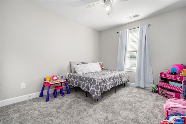 bedroom with a ceiling fan, carpet flooring, visible vents, and baseboards