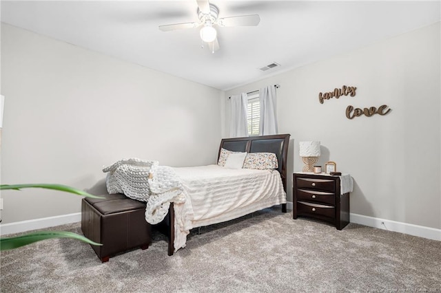 carpeted bedroom featuring baseboards, visible vents, and a ceiling fan