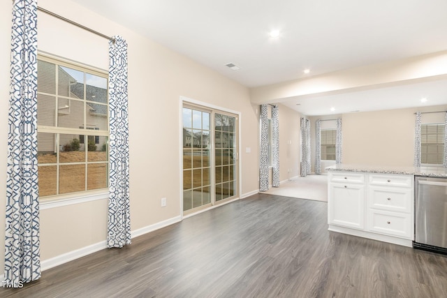 interior space with dark wood finished floors, visible vents, recessed lighting, and baseboards