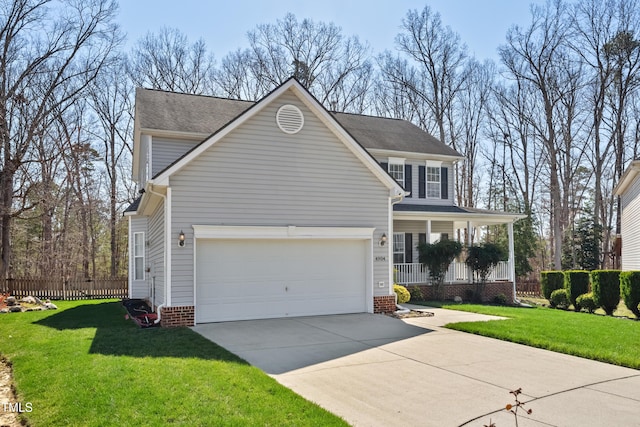 traditional home featuring a porch, driveway, and a front yard