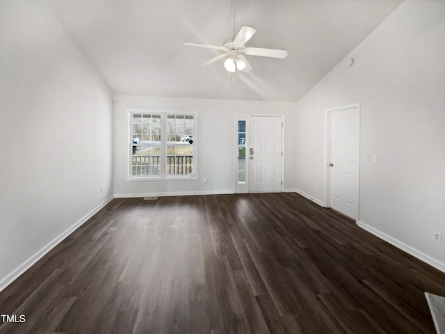 unfurnished living room featuring a ceiling fan, lofted ceiling, dark wood-style flooring, and baseboards