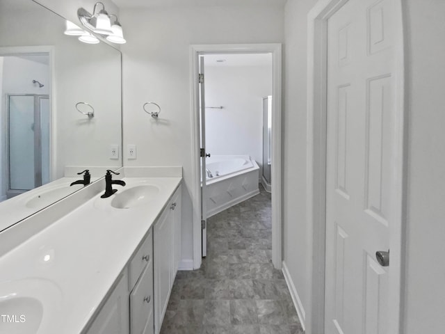 bathroom featuring a garden tub, a sink, baseboards, and double vanity