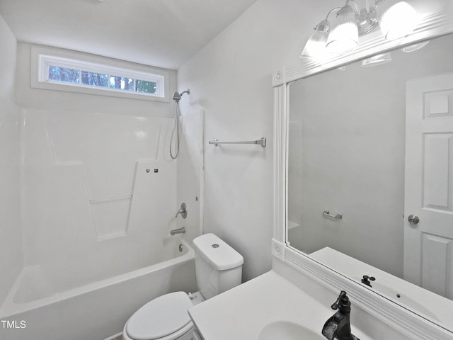 bathroom with toilet, tub / shower combination, and vanity