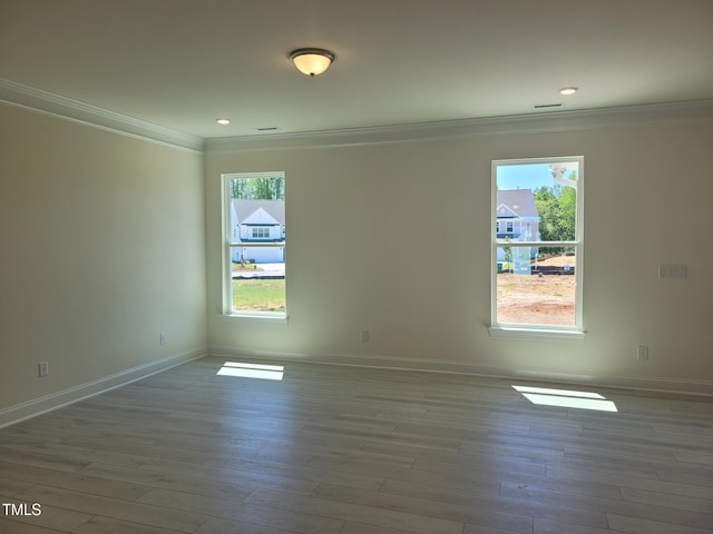 3703 Cessna Way Unit 9, Wilson, NC 27896 - unfurnished room with ornamental molding, healthy amount of natural light, baseboards, wood finished floors, and recessed lighting