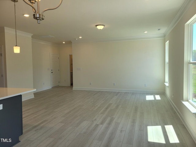3703 Cessna Way Unit 9, Wilson, NC 27896 - unfurnished living room with ornamental molding, light wood-style flooring, baseboards, a chandelier, and recessed lighting