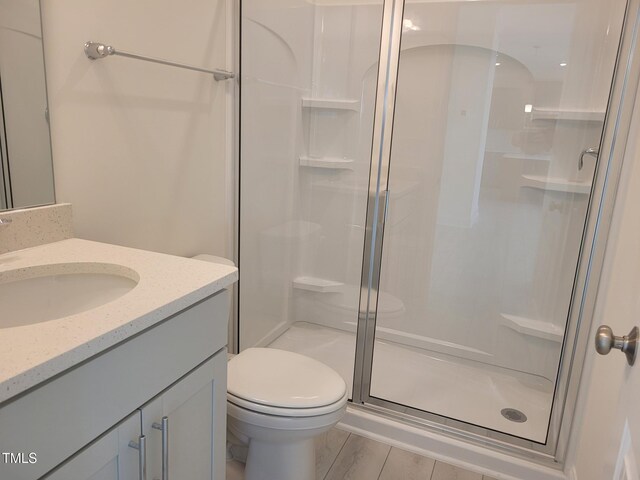 3703 Cessna Way Unit 9, Wilson, NC 27896 - bathroom featuring toilet, a stall shower, and vanity