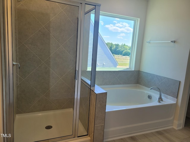 3703 Cessna Way Unit 9, Wilson, NC 27896 - full bath featuring a garden tub, a shower stall, and wood finished floors