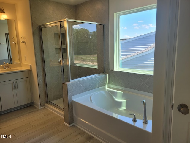 3703 Cessna Way Unit 9, Wilson, NC 27896 - full bathroom with a shower stall, vanity, wood finished floors, and a bath