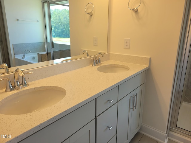 3703 Cessna Way Unit 9, Wilson, NC 27896 - full bath with double vanity, a bath, a stall shower, and tile patterned floors