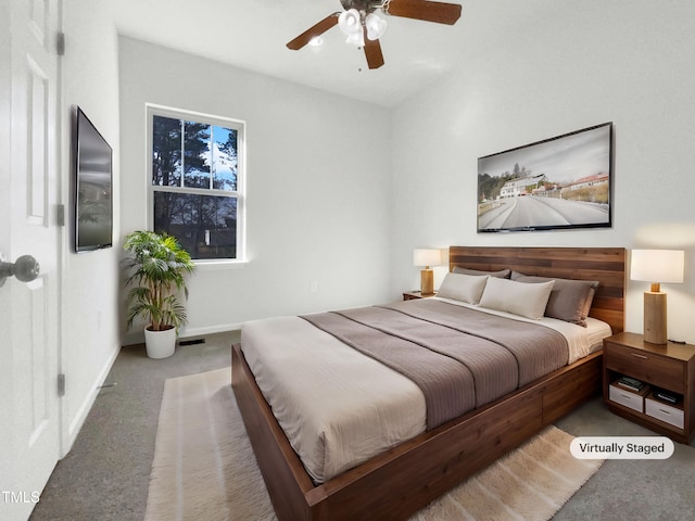 bedroom featuring carpet, baseboards, and ceiling fan