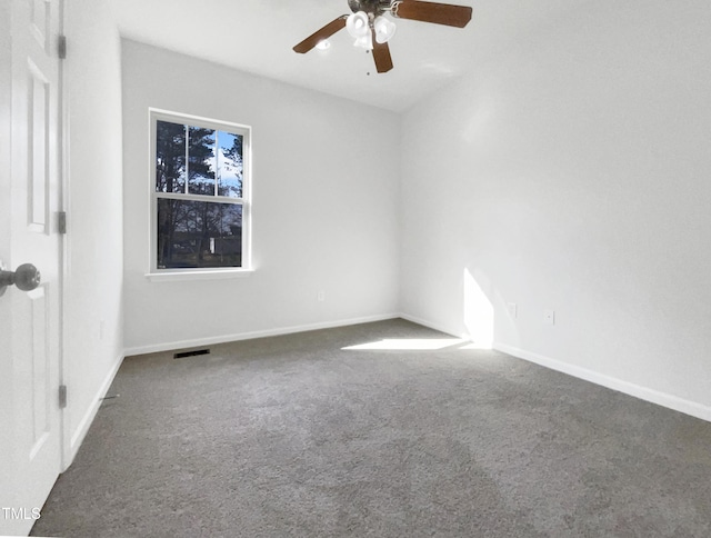 empty room featuring carpet, visible vents, ceiling fan, and baseboards