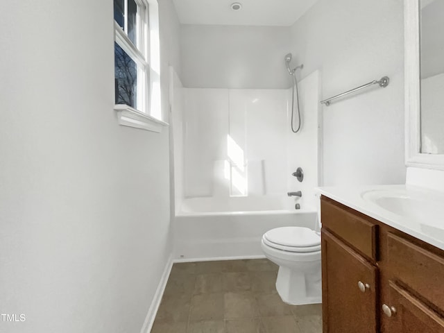 full bath with shower / washtub combination, toilet, vanity, baseboards, and tile patterned floors