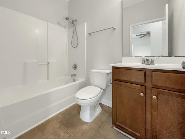 full bath featuring toilet, tile patterned flooring, shower / bathing tub combination, and vanity