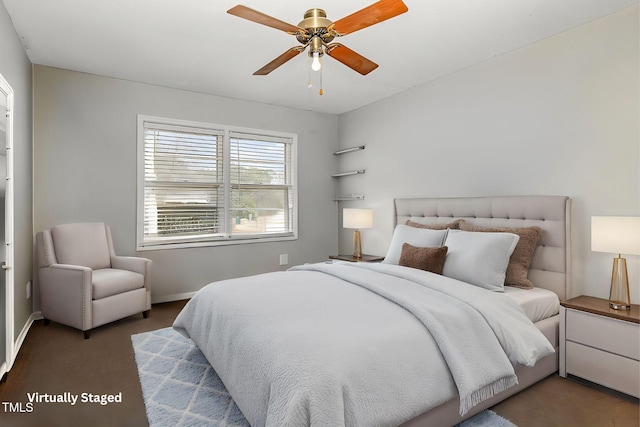 carpeted bedroom with a ceiling fan and baseboards