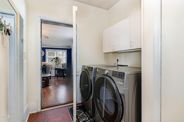 laundry area with cabinet space and washing machine and clothes dryer